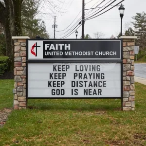 A church monument sign with message board.